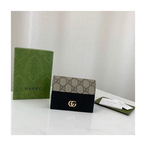 the simpsons gucci wallet|GG Marmont card case wallet in dark gold leather .